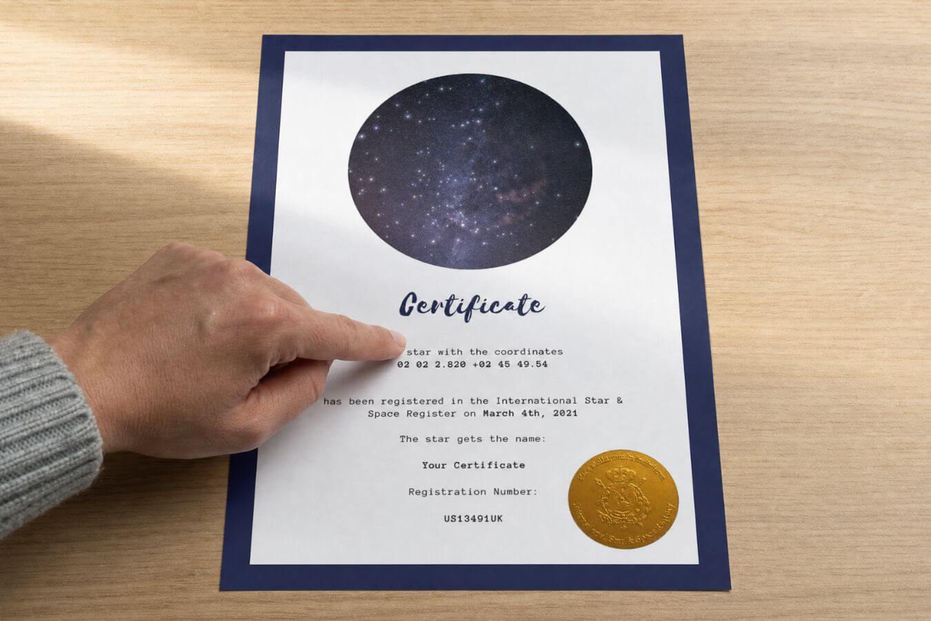 Person checking the personalized name and date on a star dedication certificate